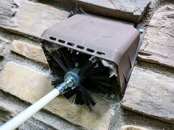 Cleaning a dryer vent with a spinning brush